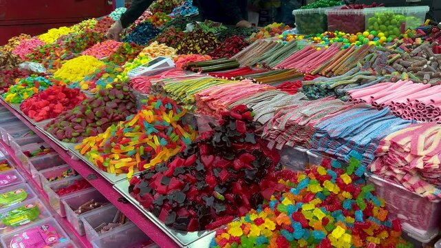 Candy store, jelly candies, colorful dragees. Gummy bears, fruits.
