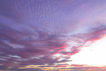 Spectacular purple and pink sunset in prairies with cloudy sky beautiful phenomenon in atmosphere.