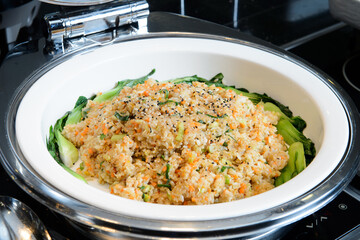 Vegetable fried rice surrounded by bok choy
