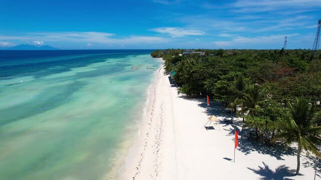 Aerial view of Quinale Beach in Anda, Bohol, Philippines during a perfect sunny day.