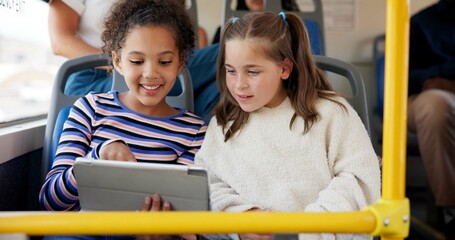 Happy girls, school bus or reading with tablet for learning, education or entertainment in public transport. Children, kids or students with smile on technology in vehicle for travel, journey or trip