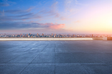 Shanghai cityscape view from empty rooftop platform at sunrise
