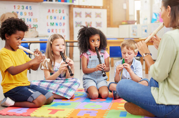 Teacher, flute and students in classroom, education and musical instruments with talent. Group, educator and kids with skills, practice and training for performance, creativity and child development