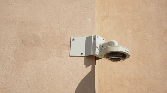 Security camera installation on exterior wall of building