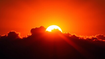 Spectacular Sunset with Dramatic Cloud Formation and Radiant Sunbeams Creating a Golden Horizon