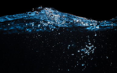 Water Wave. Air Bubbles Float Up in Water. Water Splashing. Pure Water Textured on Black Background.