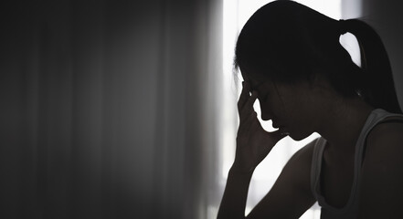 Depressed woman. Loneliness Teenage Girls. sad woman cry. Sad woman sitting alone in a empty room. The concept of sexual harassment against women and rape.