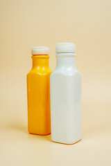 Shampoo and hair conditioner on a beige background. Foam and soap bubbles. Space for text. Advertising banner, mockup