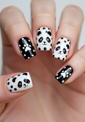 Black and White Panda Nail Design with Cute Paw Prints