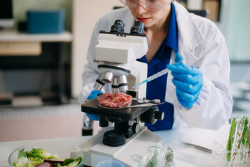 Scientist analyzing food samples in modern lab with advanced equipment for safety, nutrition, and biotechnology research.