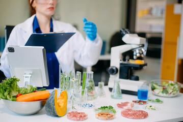 Scientist analyzing food samples in modern lab with advanced equipment for safety, nutrition, and biotechnology research.