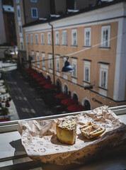 A delicious freshly baked cinnamon scroll cooling at an open window