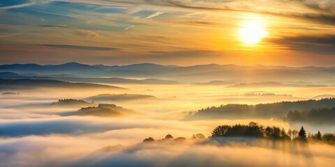 Naklejka premium Golden Sunrise Over Misty Mountain Ranges, Illuminating Rolling Hills and Forests in a Breathtaking Panorama