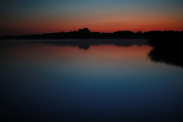 Naklejka premium Beautiful colour night sky river. Bright moon. Clouds and stars in high mountains.