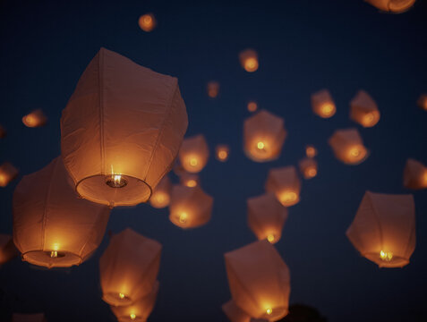 Magical sky lantern release at night &ndash; celebration of light and wishes