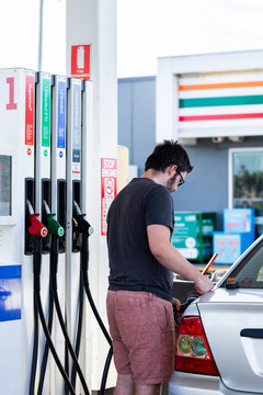 Service station fuel pump with nozzles for selection of petrol and diesel