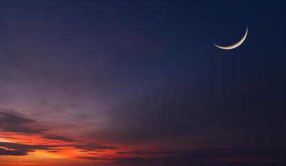 Crescent moon on dusk sky twilight after sundown, well free space for text Arabic religious of...