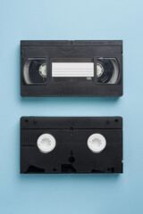 Top view of old VHS video tape on blue background
