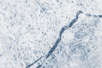Ice texture crystal, blue tones background. Textured cold frosty surface of ice with crack.