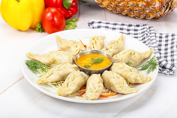 Steamed asian dumpling momo with meat