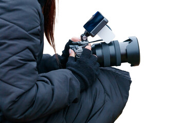 Fototapeta premium A woman is holding a camera with a blue lens