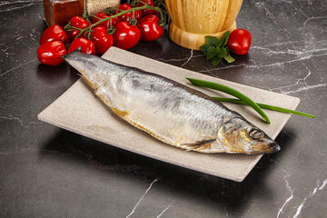 Whole raw salted herring fish