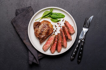 A perfectly cooked sliced striploin steak with a juicy, tender texture