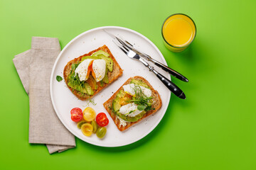 Delicious avocado toasts topped with perfectly cooked poached eggs