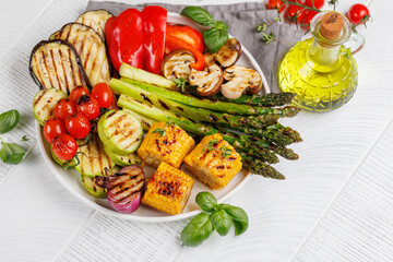 Assorted grilled vegetables on a plate, showcasing a colorful meal