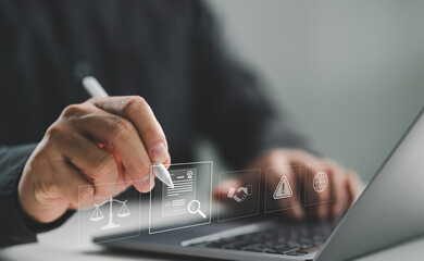 Compliance in business concept. Person use laptop with compliance icon on virtual screen, ensuring...