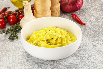 Italian cuisine - yellow risotto with chicken