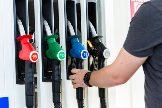 Service station fuel pump with nozzles for selection of petrol and diesel