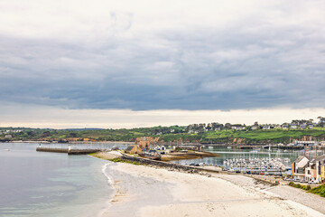 View at beach by a bay and a coast village at the coast at Bretagne
