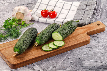 Raw green cucumbers with slices
