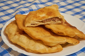 chebureks on a plate, Chebureki on a plate. National Ukrainian, Russian, Turkish, Romanian and Tatar food. Meat pastry meal on a table.