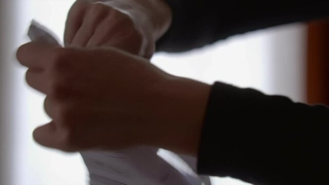 tearing off paper sheets in slowmotion