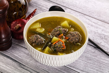Soup with beef meatballs and vegetables