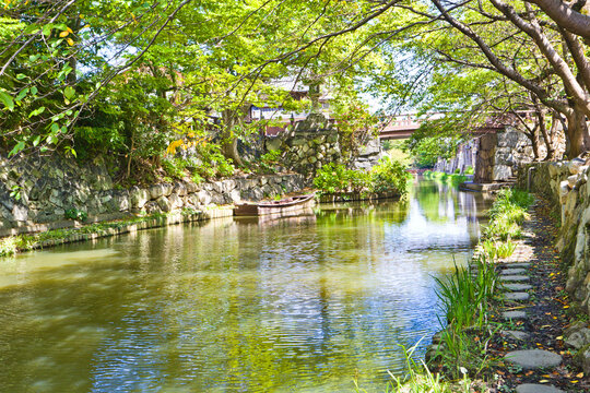 Japanese-style boat takes tourists around Hachiman-bori canal in Omihachiman town.