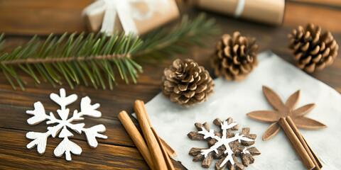 Fototapeta premium Christmas decorations with a cozy atmosphere on a wooden table with copy space