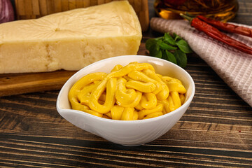 Yellow cheese sauce in the bowl