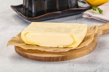 Dairy butter piece over board