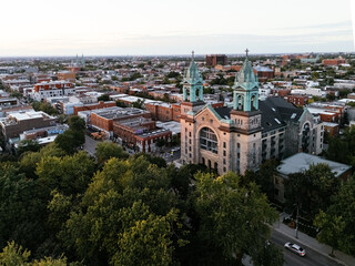 Naklejka premium Place Delacroix Church transformed into residential condos in Montreal at sunset, Quebec, Canada
