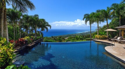 Fototapeta premium Scenic view of infinity pool overlooking ocean and lush landscape under clear blue sky