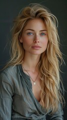 Naklejka premium studio portrait of a woman, blonde with long hair and blue eyes