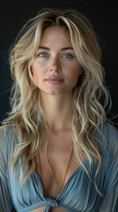 Fototapeta premium studio portrait of a woman, blonde with long hair and blue eyes