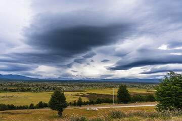 Dramatic rain clouds over pasture land in Patagonia