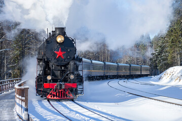 Old locomotive on winter day. Karelia, Russia