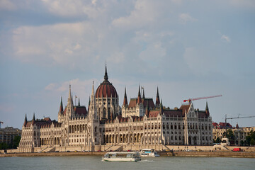 Fototapeta premium Hungarian Parliament Building in Budapest at sunset with reflection in Danube River. Neo Gothic architecture and famous landmark of Hungary