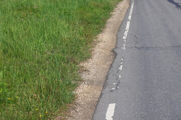 Roadside, white road markings, green grass, empty highway on a summer day, Moscow, August 2023m 2