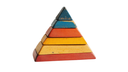 Stacked wooden blocks forming a colorful pyramid in a playroom setting during daylight hours